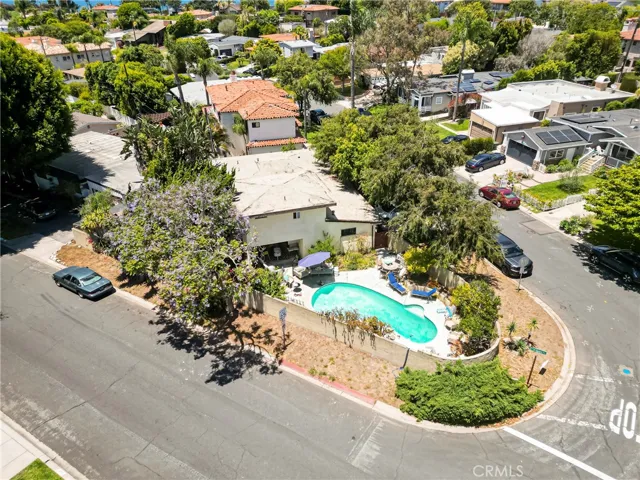 DRONE SHOT OF POOL AND HOUSE FROM THE SIDE