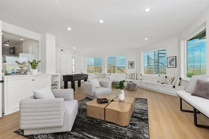 Massive games room with views in every direction. Also has a full bathroom which opens to side yard and also serves the pool  and sports court area.