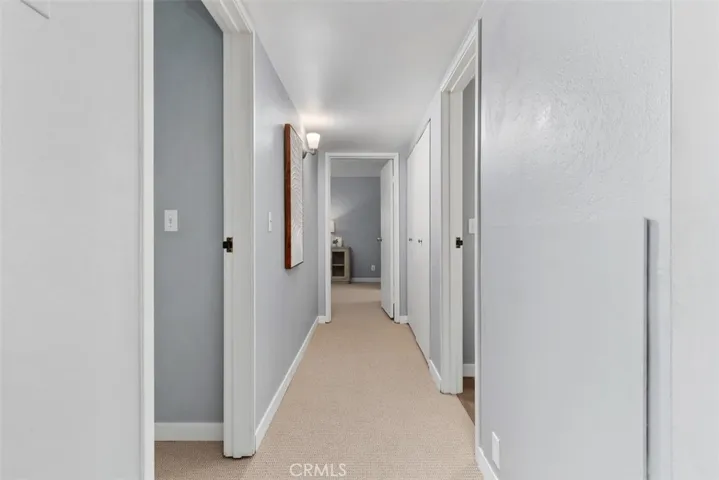 Hallway to bedrooms, guest bath and laundry room