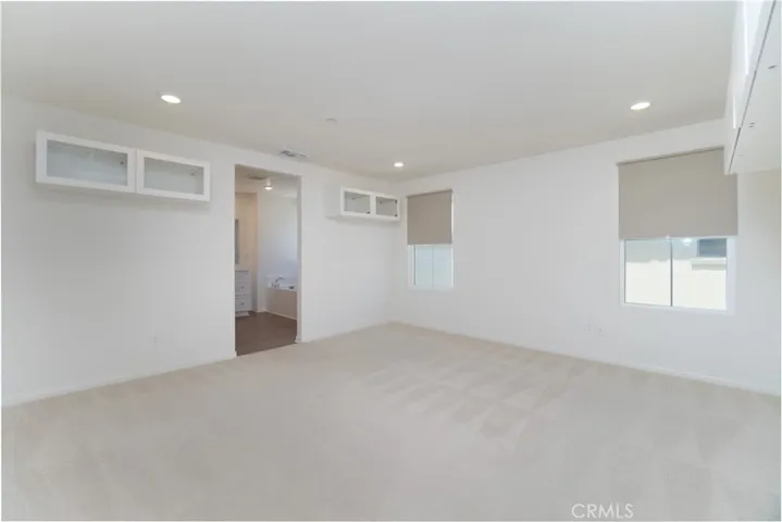 Walk-in closet, soaking tub, separate shower, double sinks and privacy toilet door