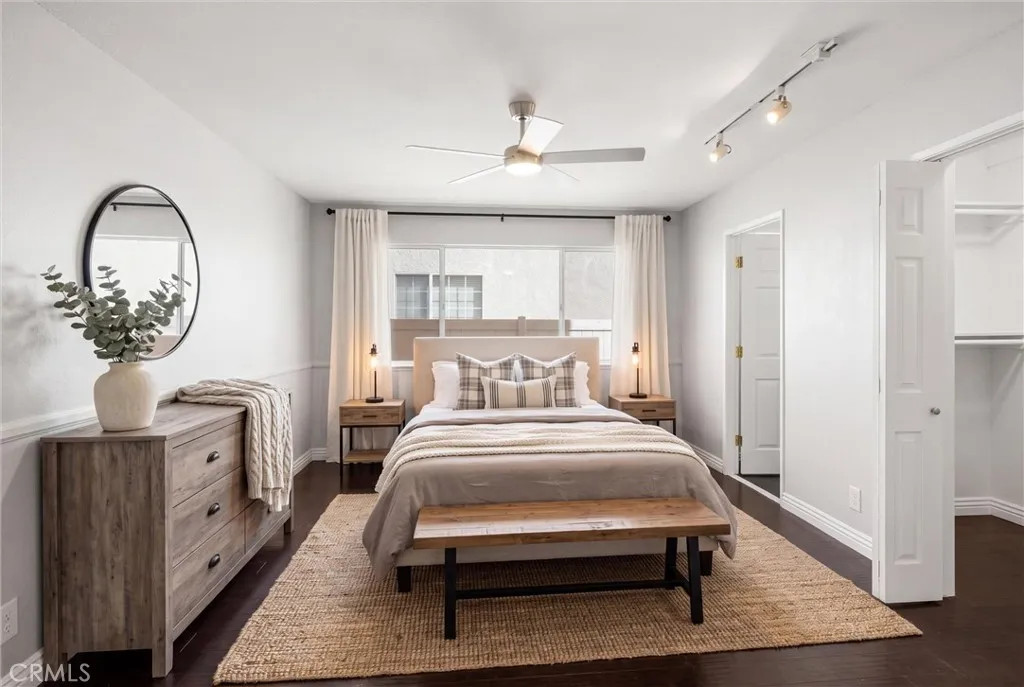 Bedroom on first floor with walk in closet and walk in shower.