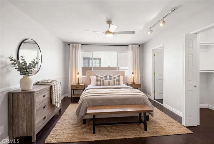 Bedroom on first floor with walk in closet and walk in shower.
