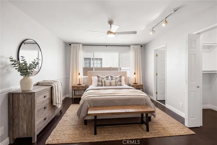 Bedroom on first floor with walk in closet and walk in shower.