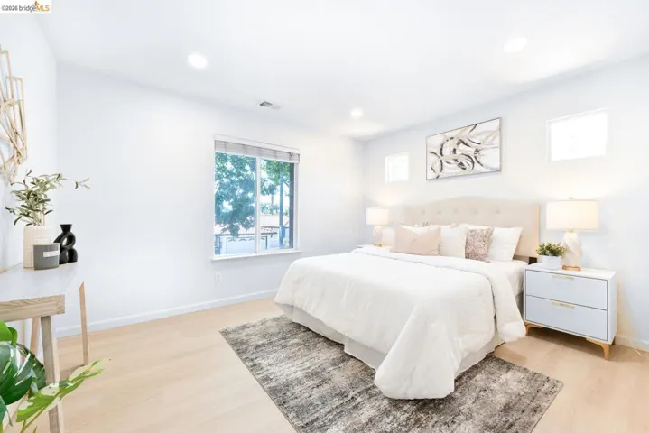 Bedroom featuring wood-finish flooring and recessed lighting
