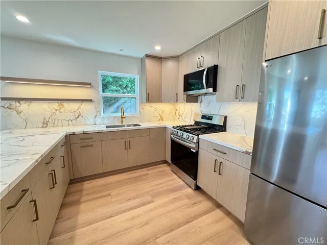 Refrigerator, range/stove, and microwave included