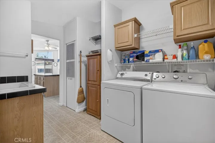 Laundry room with utility sink & additional storage
