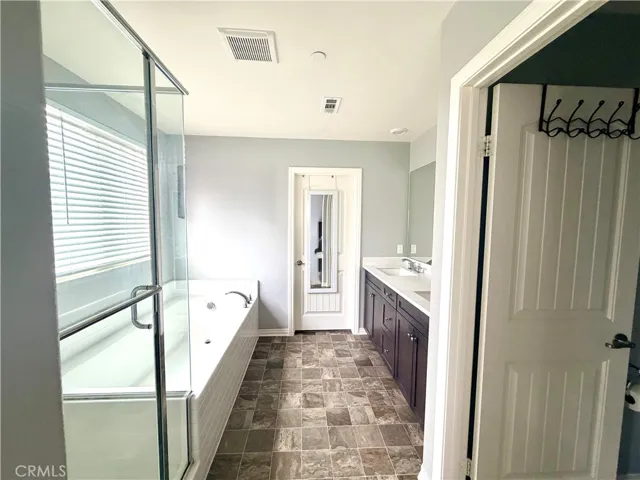 Primary Bath Ensuite Separate Shower Tub Walk-in Closet