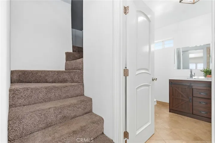 Steps leading to the loft for additional storage or can be used as gym