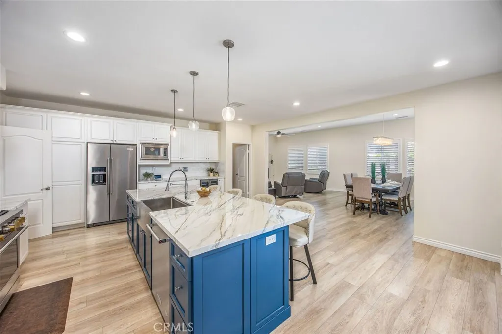 Open-concept gourmet kitchen that flows effortlessly into the living and dining areas