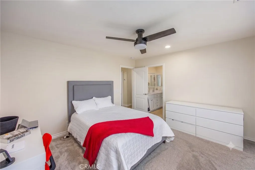 Spacious secondary bedroom with direct access to a full bathroom