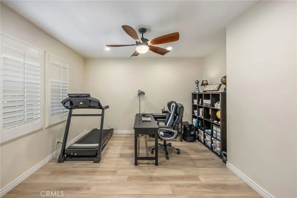 Versatile main-level room ideal for a home office, fitness space, playroom, or additional living area