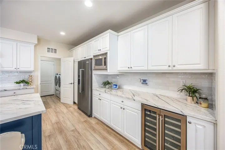 Extensive cabinetry and counter space for storage and meal preparation