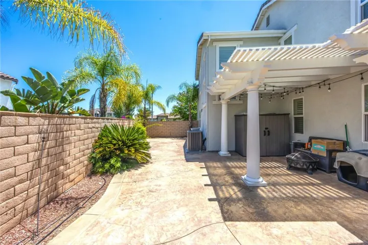 Spacious covered patio extends the home's outdoor living area