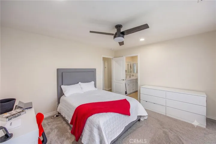 Spacious secondary bedroom with direct access to a full bathroom