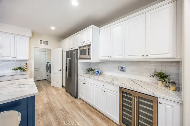 Extensive cabinetry and counter space for storage and meal preparation