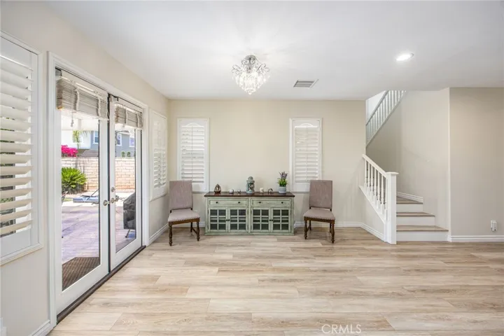 Living area with French doors providing seamless access to the backyard and outdoor entertaining spaces