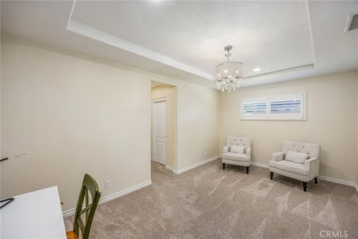 Spacious primary suite with dedicated sitting area