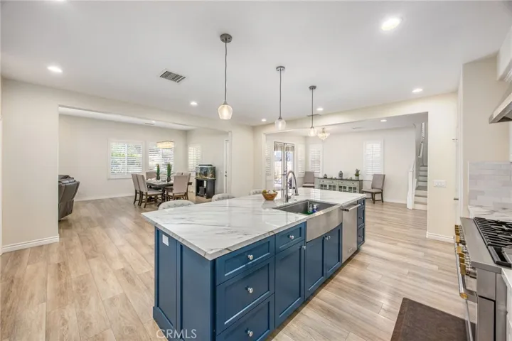 Open-concept kitchen with seamless flow to the dining and living areas