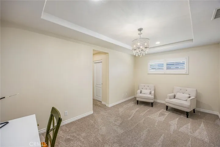 Spacious primary suite with dedicated sitting area