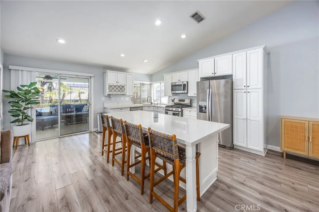 Spacious kitchen featuring a large center island with bar seating