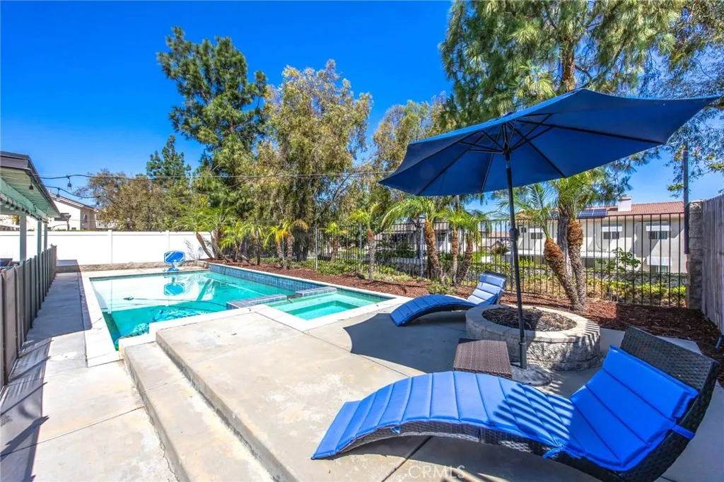 Private backyard retreat with a pool, spa, and mature landscaping