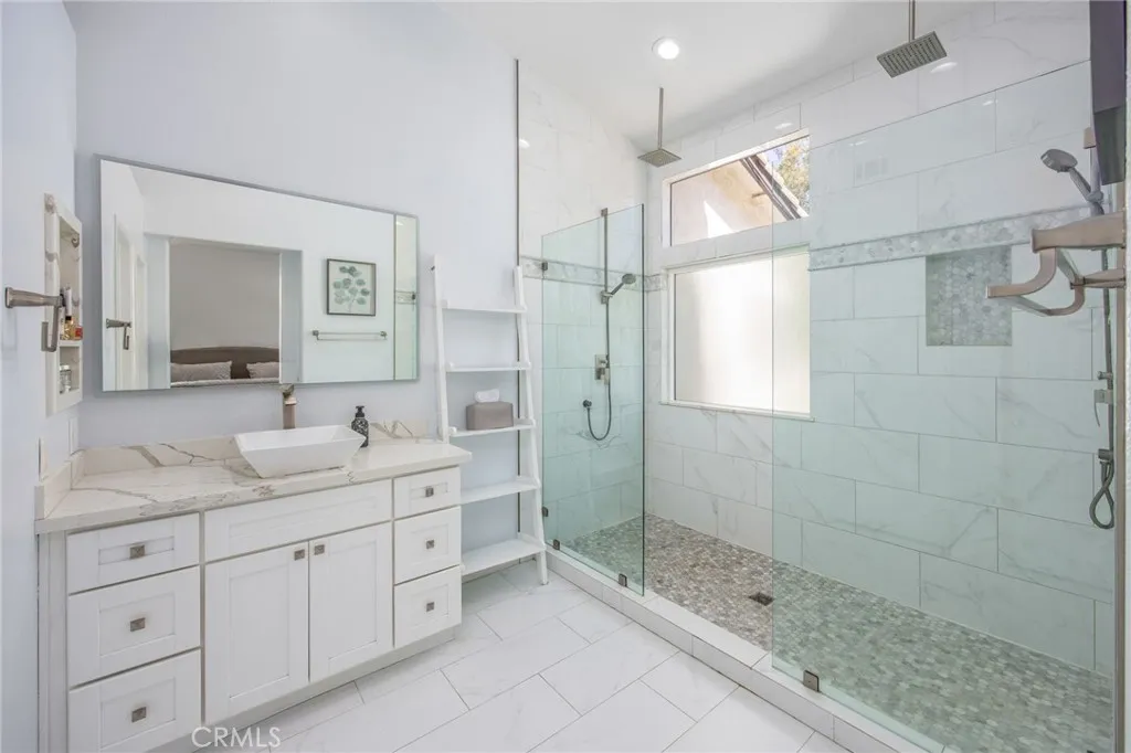 Updated primary bathroom with a spacious walk-in shower