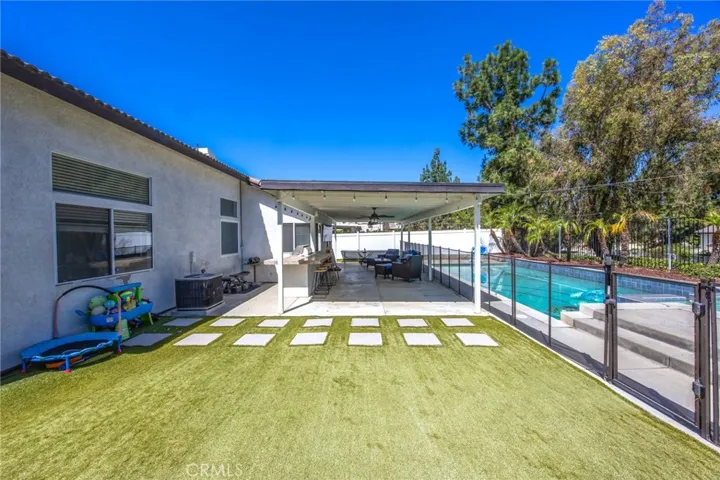 Private backyard featuring low-maintenance landscaping