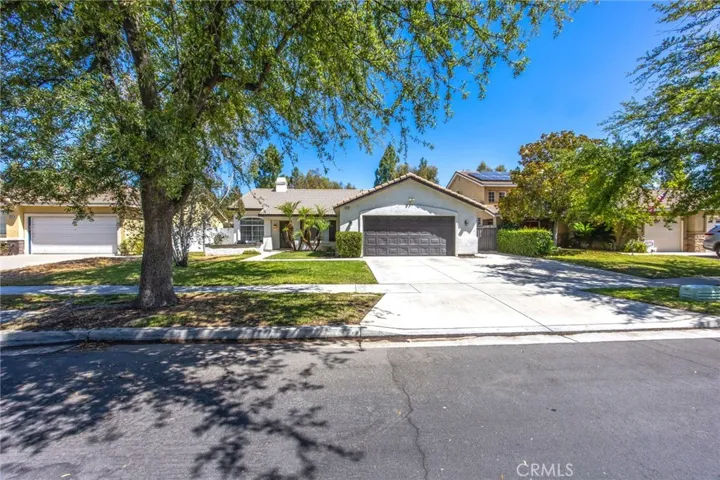 Wide driveway and attached two-car garage provide convenient off-street parking