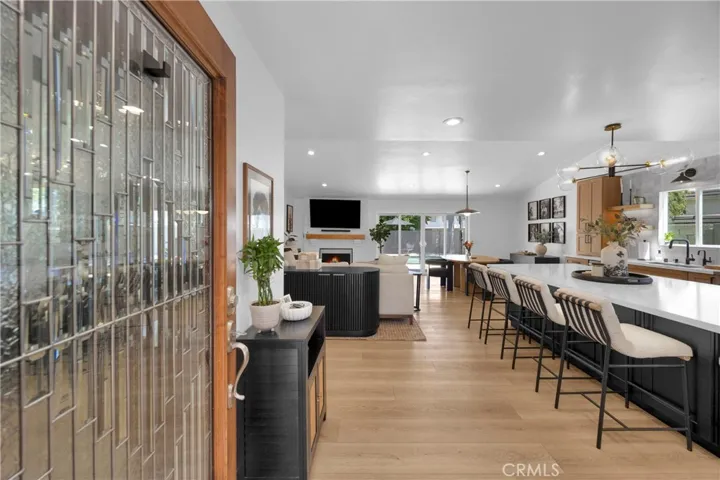 Front door/entry, open concept kitchen and family room.