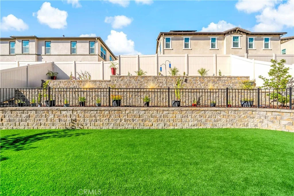Large terraced fenced area for plants or garden
