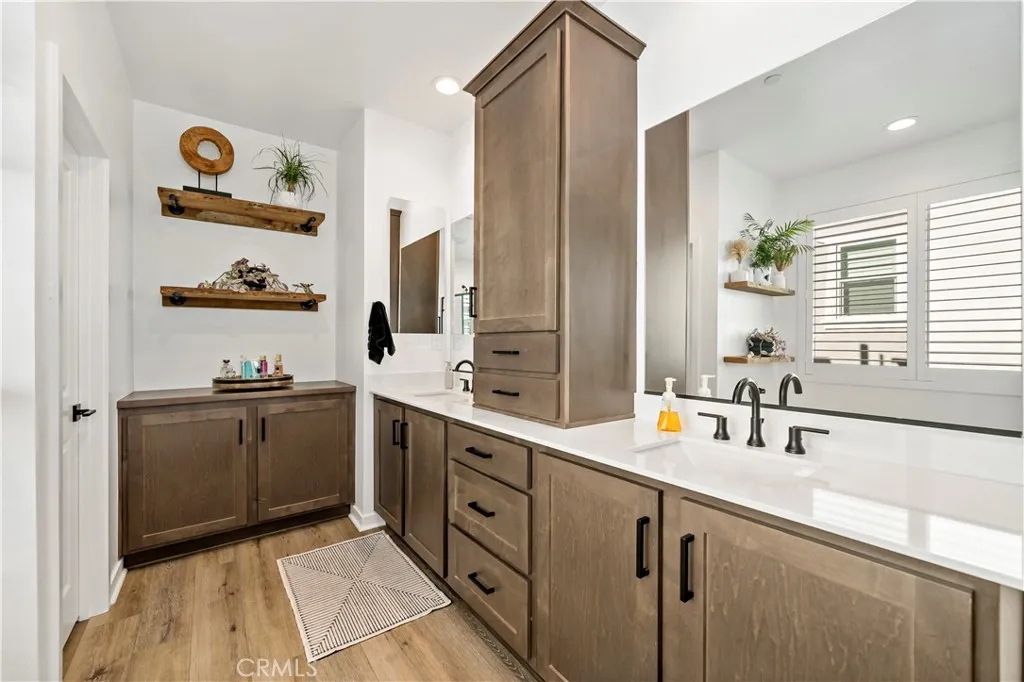 Owners en suite with additional custom cabinetry