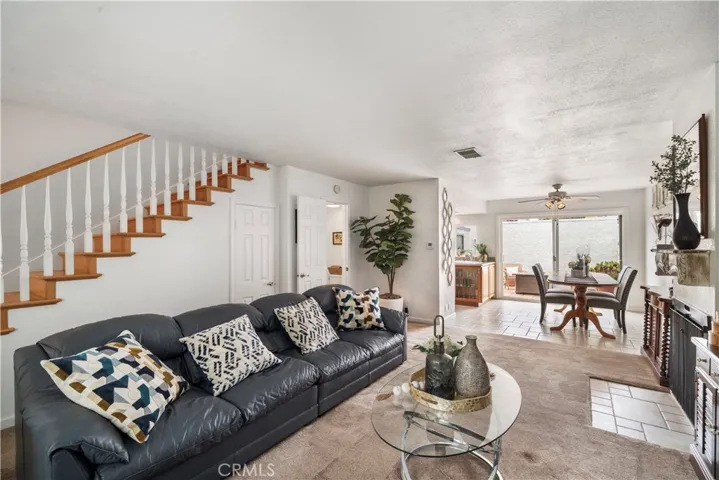 Living room with fireplace and dining room that is open to the kitchen