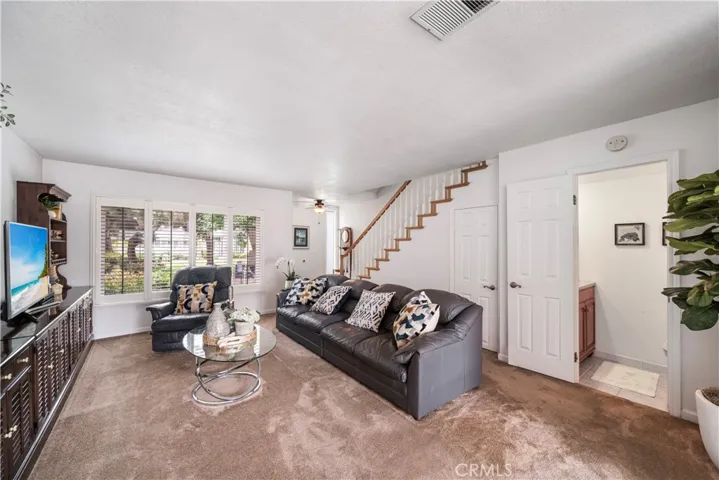 Living room and half bath on right