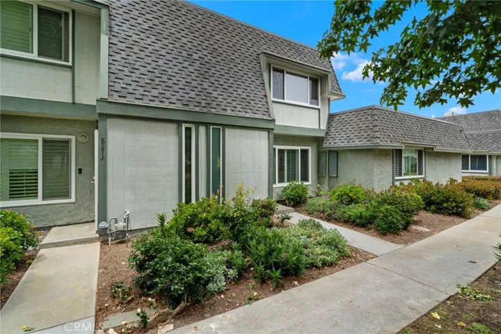 Walking path to the front door of this fabulous townhome