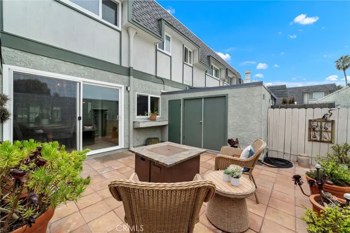 The patio has a buffet counter outside the kitchen window, a storage closet, and a laundry closet that will house full-size appliances