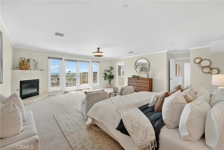 Primary suite with fireplace and ocean views