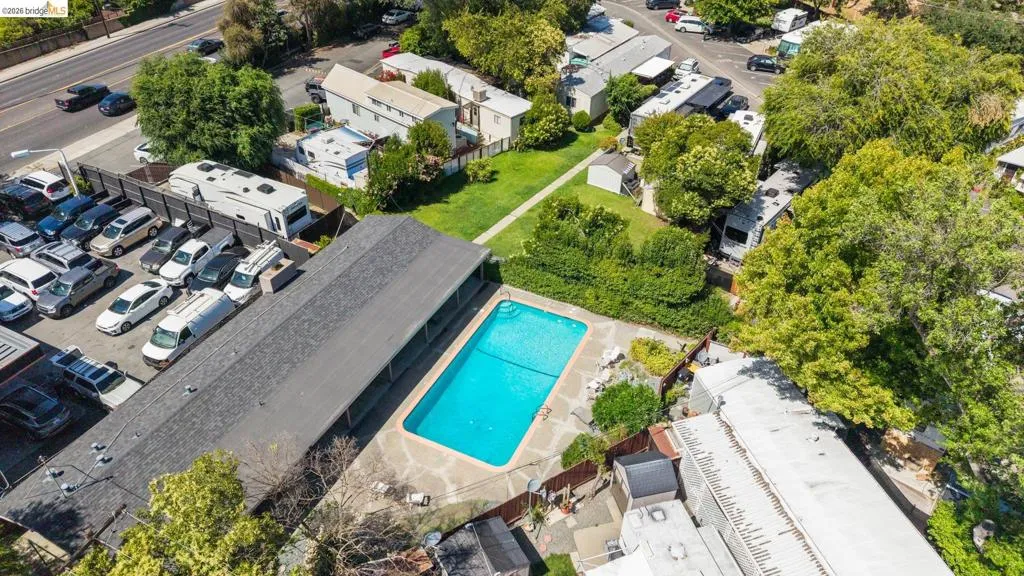 Outdoor swimming pool with irregular stone paving surround