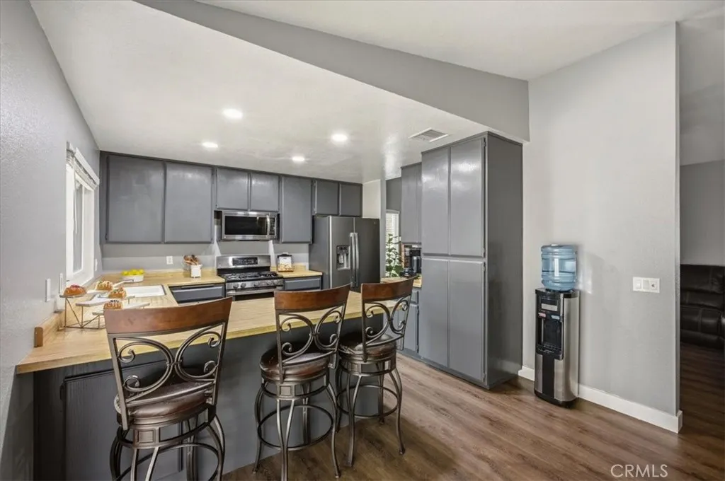 Bar counter that is open to the kitchen and large dining area