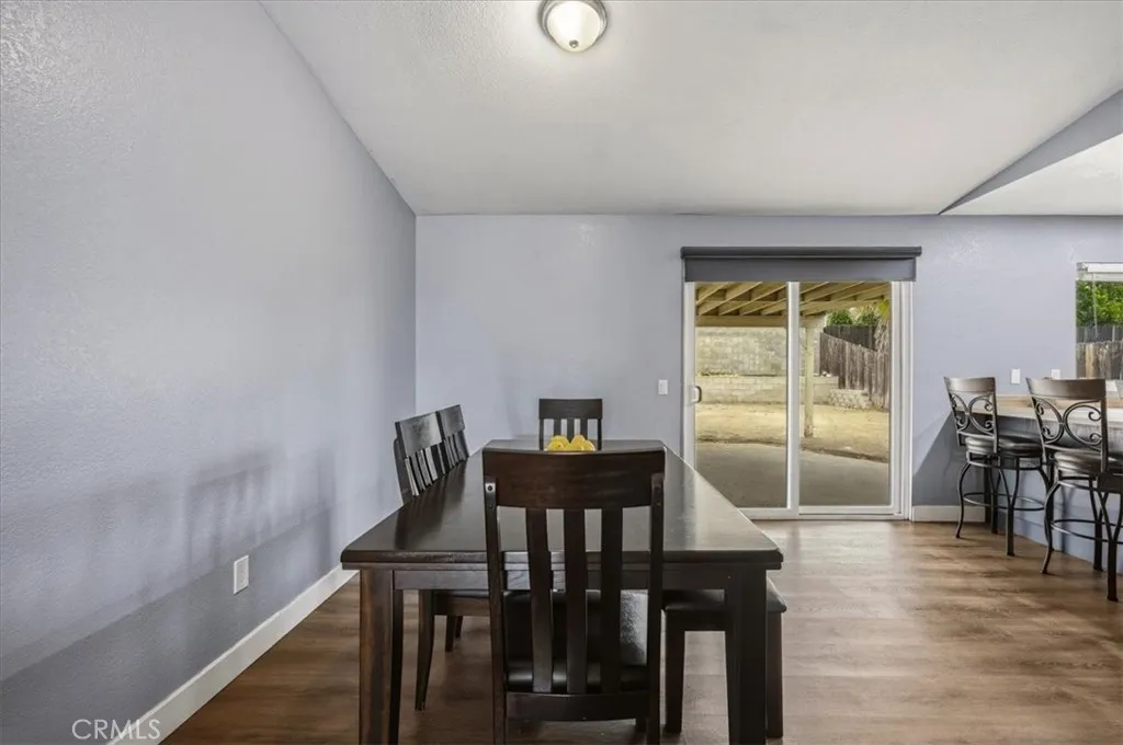 Open concept dining area with a wonderful sliding door. Great for natural light and bringing in grilled food from the backyard.