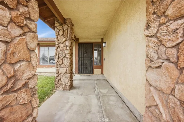 Beautiful entry makes a statement with rock covered columns