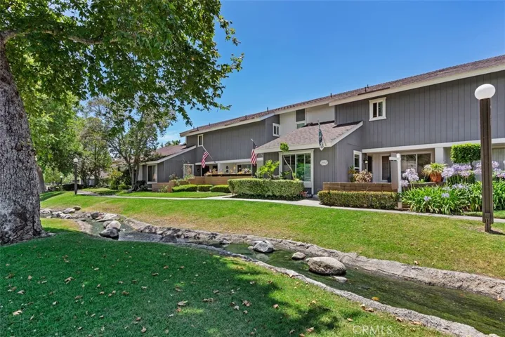 IT IS ALWAYS ABOUT THE LOCATION. THIS HOME HAS VIEWS OF THE SKY, HILLS AND BEYOND.  THE FLOWING STREAM IN FRONT, PLUS TREES AND GREEN BELTS.