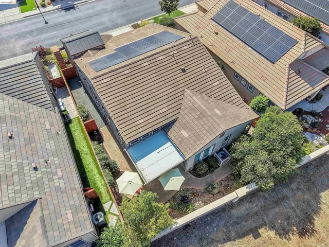 Tile roof residence featuring multiple solar panel installations