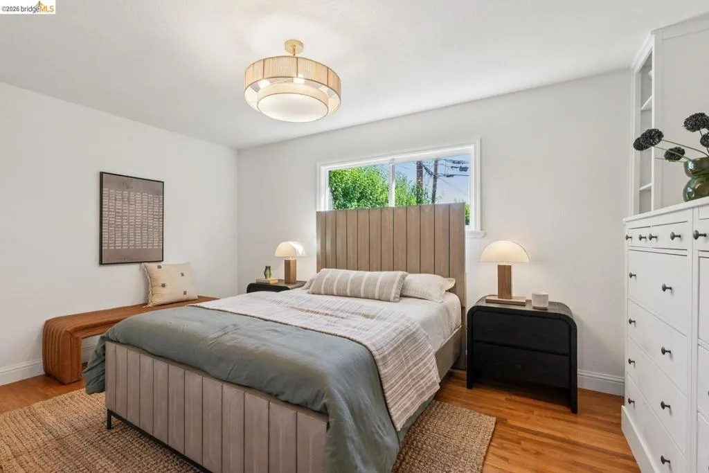 Hardwood flooring complemented by white baseboards