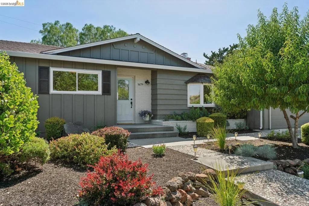 Exterior facade featuring horizontal siding and board and batten accents