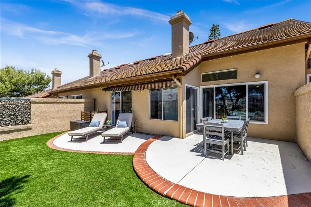 he back patio can be accessed in two ways—through the living room and directly from the primary bedroom—enhancing seamless indoor-outdoor living.