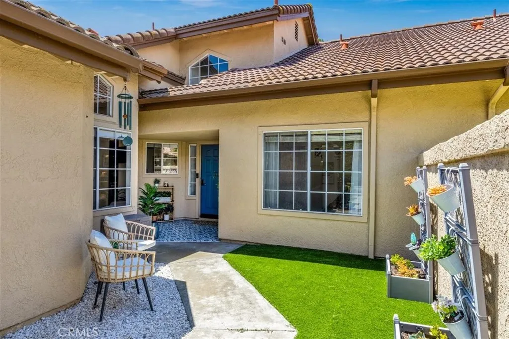 Private gated courtyard entrance welcomes guests with style & warmth.