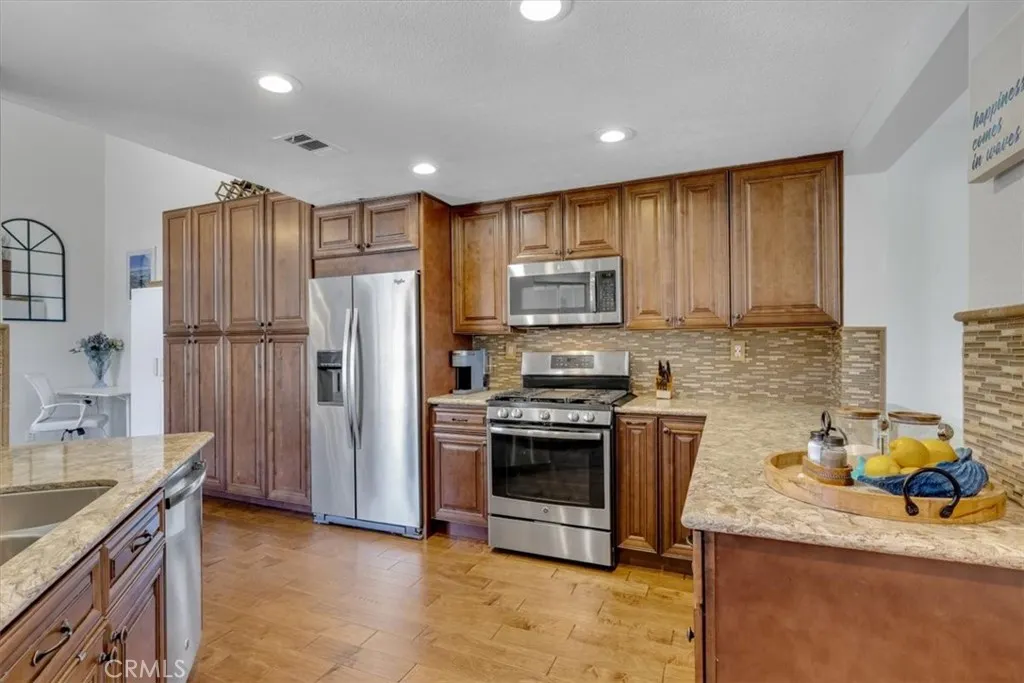 The kitchen was expanded into the former family/nook area and includes additional storage and pantry space!