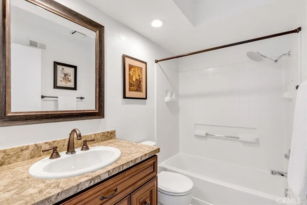 The third full bath is located upstairs in the loft area.