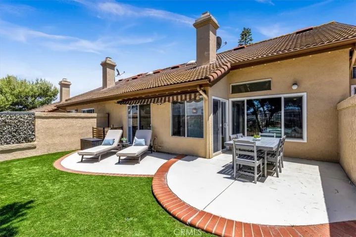 he back patio can be accessed in two ways—through the living room and directly from the primary bedroom—enhancing seamless indoor-outdoor living.