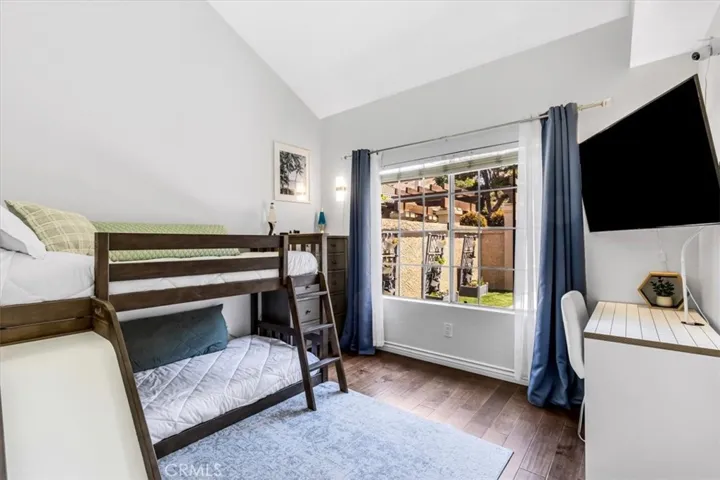 Also on the main level is the spacious second bedroom overlooking the front courtyard.